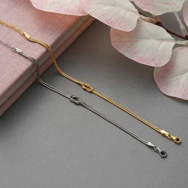Liebesknoten Partnerarmband aus Edelstahl in Silber und Gold mit Knoten-Detail
